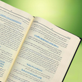 Close-up of Noble Quran Arabic text with Pashto translation and Tafsir
